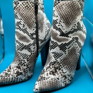 Preowned Snake skin print pointed toe mid boot